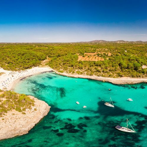 Bay of Cala Santanyi with beach and boats on Mallorca