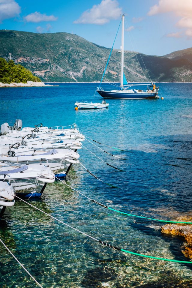 Boats on the shore and turquoise bay, crystal-clear water in the east of Mallorca