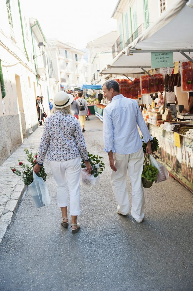 Couple shopping at the market in Muro, Mallorca