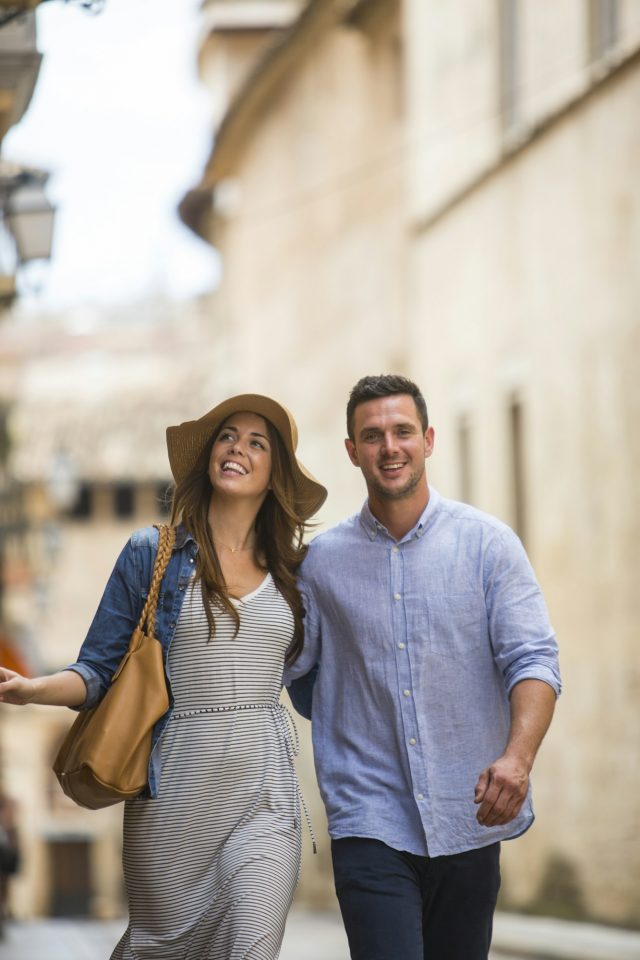 Couple walking on the street in Les Palmeres on Mallorca