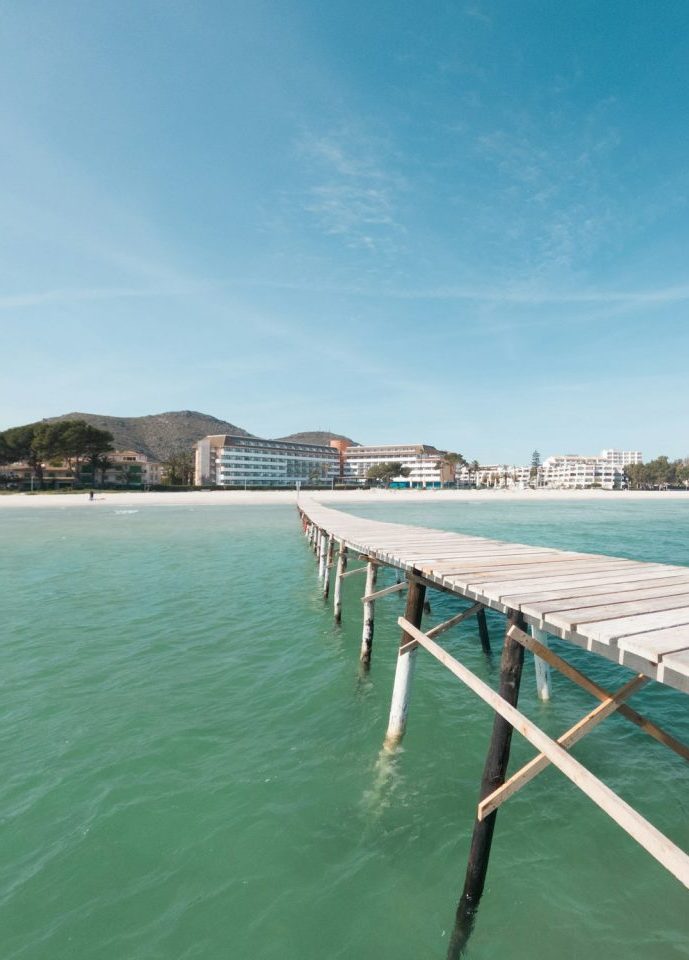 View of a wooden jetty on the beach of Can Picafort